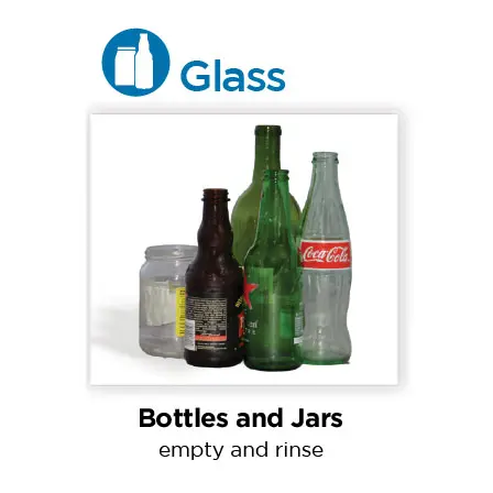 Various glass bottles and jars, including a Coca-Cola bottle, for recycling.
