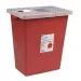 Red sharps container with a clear lid and biohazard symbol, used for safe disposal of medical waste.